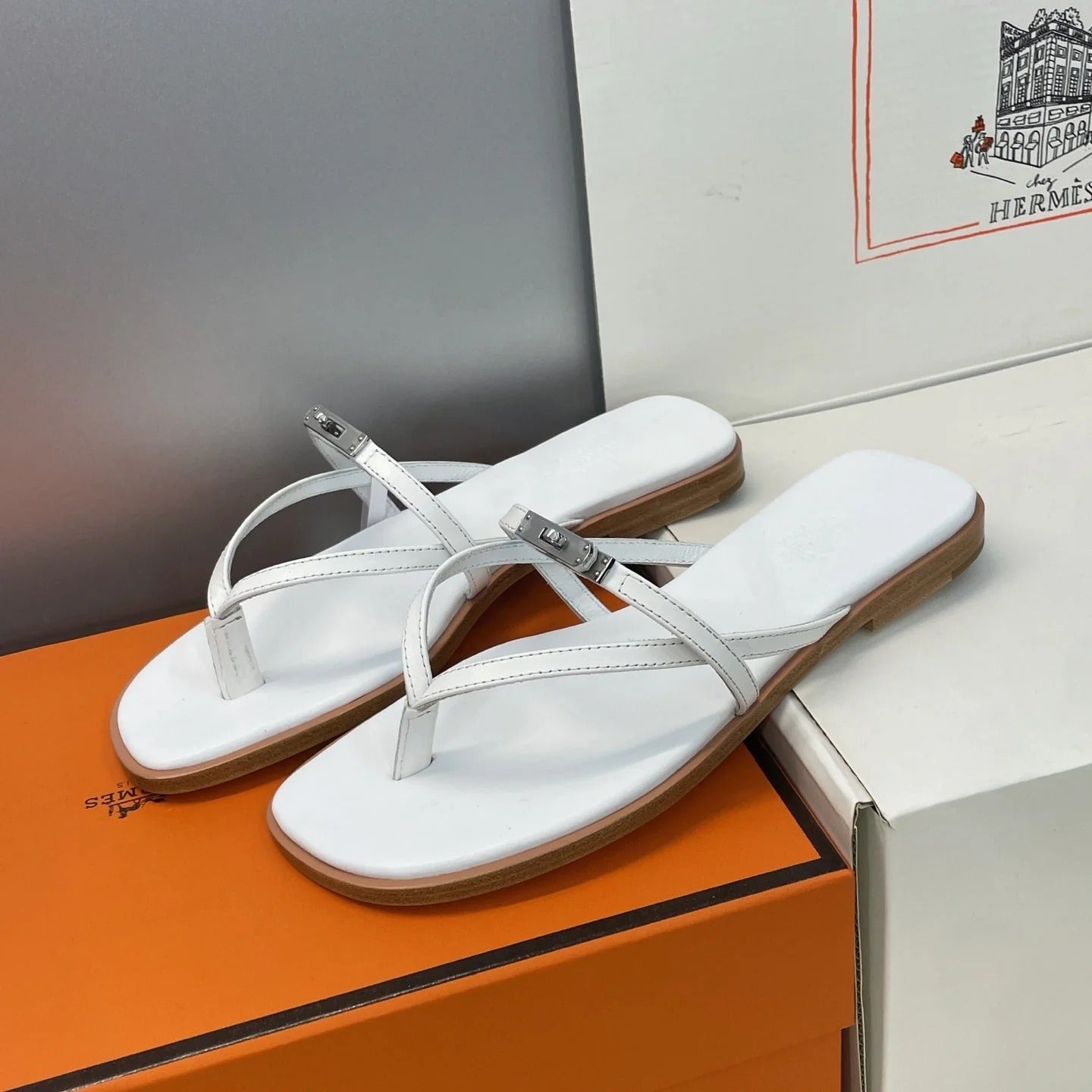 HM 26ss Kelly Sliver Buckle Slipper White Calfskin 607159